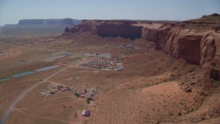AX135_204 - 5.5K aerial stock footage of flying by Goulding's Lodge, near Oljeto Mesa and Monument Valley Airport, Utah