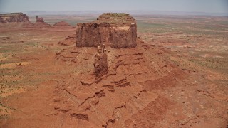 AX136_040E - 5.5K aerial stock footage of approaching giant desert buttes in Monument Valley, Utah, Arizona