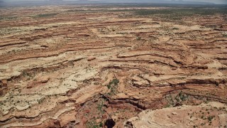 AX136_061 - 5.5K aerial stock footage of flying over mesas and a canyon, Cedar Mesa, Utah