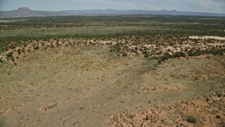 AX136_075E - 5.5K aerial stock footage of flying over Slick Horn Road and desert valley, Cedar Mesa, Utah