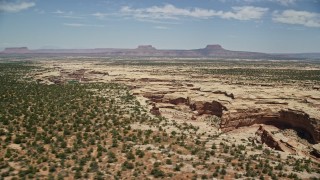AX136_080E - 5.5K aerial stock footage of orbiting the Grand Gulch canyon, Grand Gulch Primitive Area, Utah