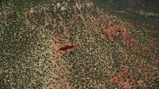 AX136_135 - 5.5K aerial stock footage of approaching rock ledges on a mesa, Manti-La Sal National Forest, Utah
