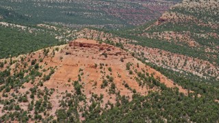 AX136_190E - 5.5K aerial stock footage of circling the top of a butte, Manti-La Sal National Forest, Utah