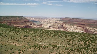 AX136_199E - 5.5K aerial stock footage of approaching box canyons in Canyonlands National Park, Utah