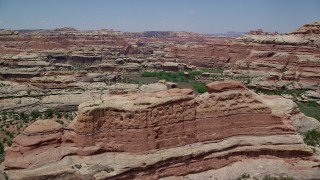 AX136_208 - 5.5K aerial stock footage of tall desert rock formations in Canyonlands National Park, Utah