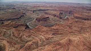 AX136_236E - 5.5K aerial stock footage flyby and approach Colorado River though Meander Canyon, Canyonlands National Park, Utah