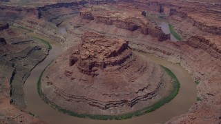 AX136_239 - 5.5K aerial stock footage of flying toward the Colorado River and butte in Meander Canyon, Canyonlands National Park, Utah