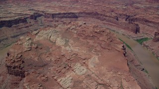 AX136_242 - 5.5K aerial stock footage of a butte and the Colorado River in Meander Canyon, Canyonlands National Park, Utah