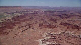 AX136_246 - 5.5K aerial stock footage approach buttes and canyons near White Rim cliffs, Canyonlands National Park, Utah