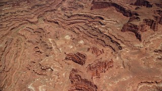 AX136_248E - 5.5K aerial stock footage of a bird's eye view of rugged canyons, buttes, Canyonlands National Park, Utah