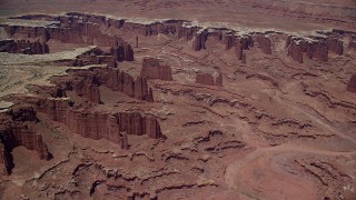 AX136_252 - 5.5K aerial stock footage of steep buttes, Monument Canyon, and White Rim in Canyonlands National Park, Utah