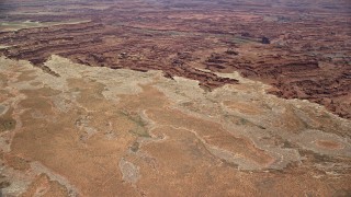 AX136_254E - 5.5K aerial stock footage of approaching canyons near the Colorado River, Canyonlands National Park, Utah