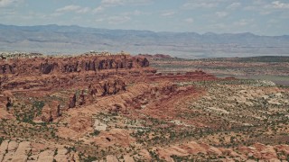 AX137_003 - 5.5K aerial stock footage of flying by Klondike Bluffs and Marching Men rock formations, Arches National Park, Utah