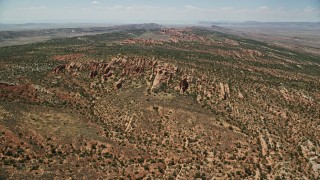 AX137_018E - 5.5K aerial stock footage of approach rocky landscape of Devil's Garden, Arches National Park, Utah