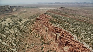 AX137_029E - 5.5K aerial stock footage tilt to bird's eye of desert cliffs in Eagle Park, Arches National Park, Utah