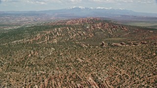 AX137_045E - 5.5K aerial stock footage of Devil's Garden rock fins at Arches National Park, Utah