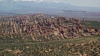 AX137_047E - 5.5K aerial stock footage of a view of rock formation in Devil's Garden, Arches National Park, Utah