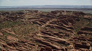 AX137_051 - 5.5K aerial stock footage of a view of Devil's Garden rock fins at Arches National Park, Utah