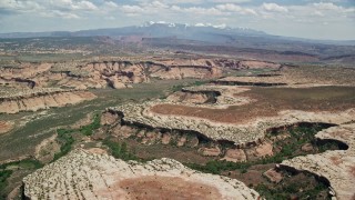 AX137_056E - 5.5K aerial stock footage of a view of the Salt Wash Canyons at Arches National Park, Utah