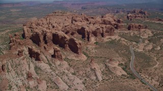AX137_070 - 5.5K stock footage aerial video approach Elephant Butte and Double Arch rock formations, Arches National Park, Utah