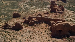 AX137_074 - 5.5K aerial stock footage of North Window, South Window and Turret Arch rock formations, Arches National Park, Utah