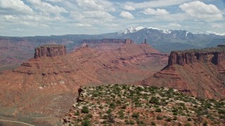 AX137_085 - 5.5K aerial stock footage of buttes and mesas seen from Dry Mesa in Moab, Utah