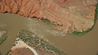 AX137_092 - 5.5K aerial stock footage of a bird's eye view of rapids on the Colorado River, Moab, Utah