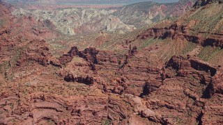 AX137_100 - 5.5K aerial stock footage of desert rock formations at Fisher Towers, Utah
