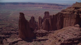 AX137_103 - 5.5K stock footage aerial video of The Titan and other rock formations at Fisher Towers, Utah
