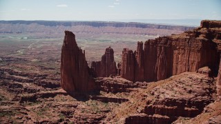 AX137_113 - 5.5K aerial stock footage approach The Titan and nearby rock formations at Fisher Towers, Utah