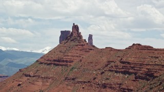 AX137_128 - 5.5K aerial stock footage flyby two buttes to reveal Castleton Tower in Moab, Utah