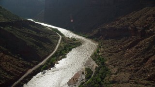 AX138_001 - 5.5K aerial stock footage of rapids on the Colorado River by State Route 128 in Moab, Utah