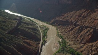 AX138_006 - 5.5K aerial stock footage of following the Colorado River and State Route 128 in Moab, Utah
