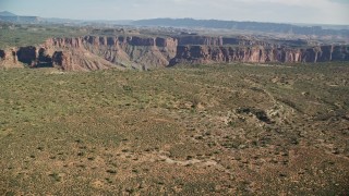 AX138_011E - 5.5K aerial stock footage of a view of Big Bend Canyon and the Colorado River in Arches National Park, Utah