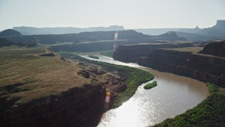 AX138_068 - 5.5K aerial stock footage of following Colorado River through Meander Canyon, Moab, Utah