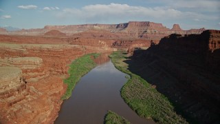 AX138_087E - 5.5K aerial stock footage fly over Colorado River in Goose Neck area of Meander Canyon, Canyonlands National Park, Utah