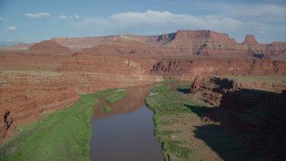 AX138_088 - 5.5K stock footage aerial video fly over Colorado River in Goose Neck area of Meander Canyon, Canyonlands National Park, Utah
