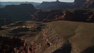 AX138_089E - 5.5K aerial stock footage approach butte from the river in Canyonlands National Park, Utah