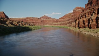 AX138_102E - 5.5K aerial stock footage fly low through Meander Canyon over the Colorado River, Canyonlands National Park, Utah