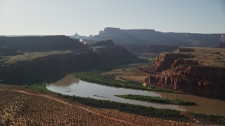 AX138_109E - 5.5K aerial stock footage of the Colorado River through Meander Canyon in Canyonlands National Park, Utah
