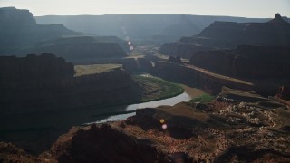 AX138_114E - 5.5K aerial stock footage pass over the Colorado River and Meander Canyon to approach Shafer Canyon, Canyonlands National Park, Utah