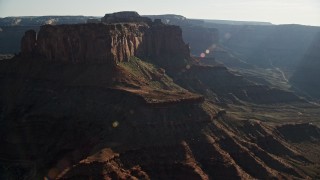 AX138_118E - 5.5K aerial stock footage flyby mesas overlooking Shafer Canyon in Canyonlands National Park, Utah