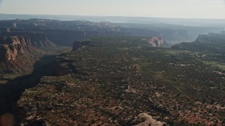 AX138_130E - 5.5K aerial stock footage approach Taylor Canyon in Canyonlands National Park, Utah