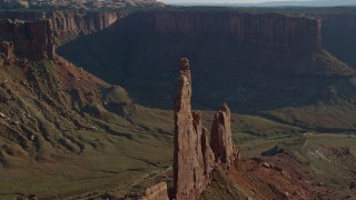 AX138_137 - 5.5K stock footage aerial video flyby Zeus and Moses Butte in Taylor Canyon, Canyonlands National Park, Utah