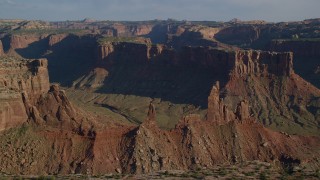 AX138_141 - 5.5K aerial stock footage of the Zeus and Moses Butte in Taylor Canyon, Canyonlands National Park, Utah