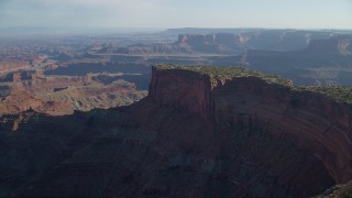 AX138_156 - 5.5K aerial stock footage approach Dead Horse Point Overlook with a view of Canyonlands National Park, Utah