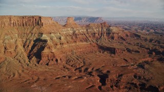 AX138_172E - 5.5K aerial stock footage of flying toward the United Nations Tablet butte in Moab, Utah