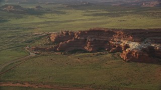 AX138_281E - 5.5K aerial stock footage of orbiting rock formations and Canyonlands Resort Park, Canyonlands National Park, Utah
