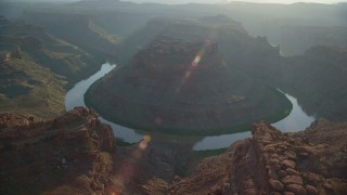 AX138_291 - 5.5K aerial stock footage orbit The Loop East in Meander Canyon and Colorado River, Canyonlands National Park, Utah, sunset