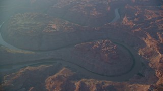 AX138_329 - 5.5K aerial stock footage circle the Colorado River in Meander Canyon at sunset, Canyonlands National Park, Utah